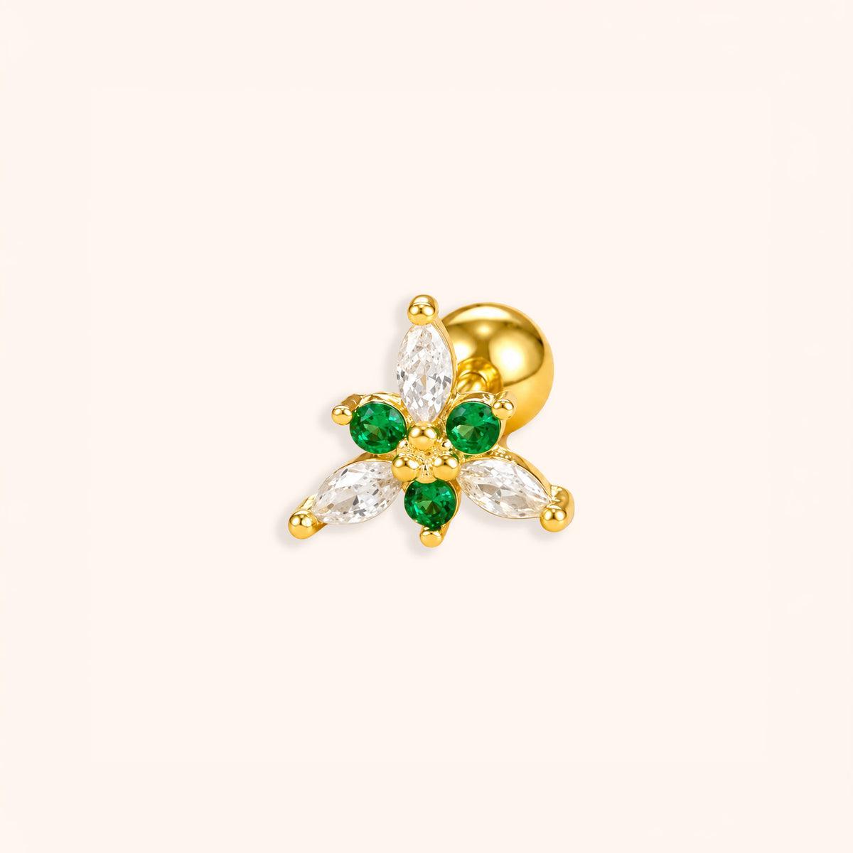 18k Gold emerald bloom stud earring with green and clear gemstones on a white background