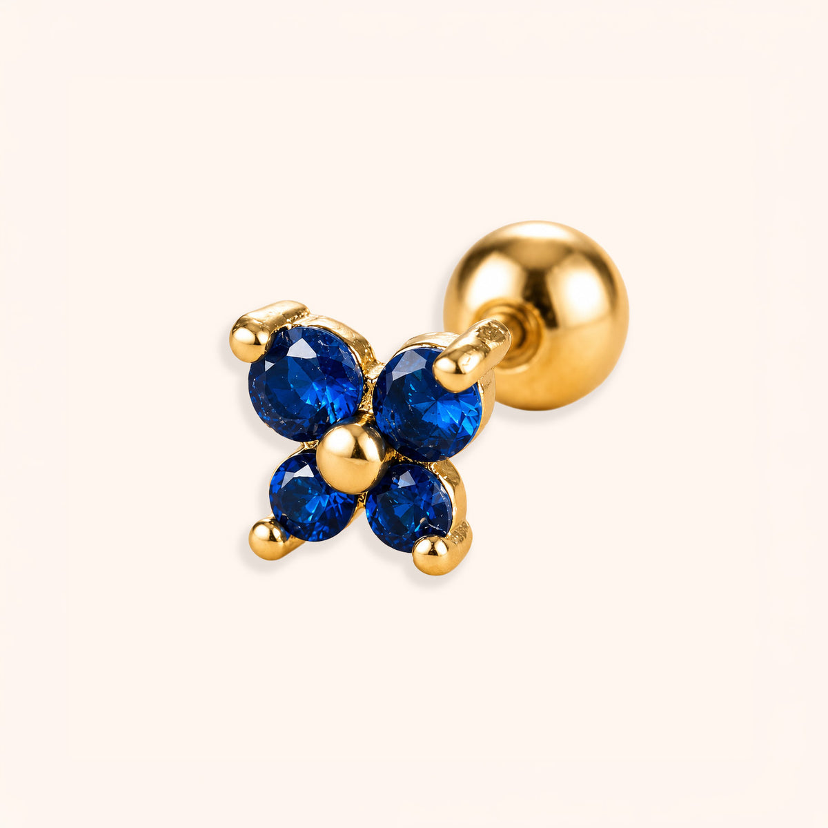 18K Gold plated helix earrings with blue gemstones on a white background