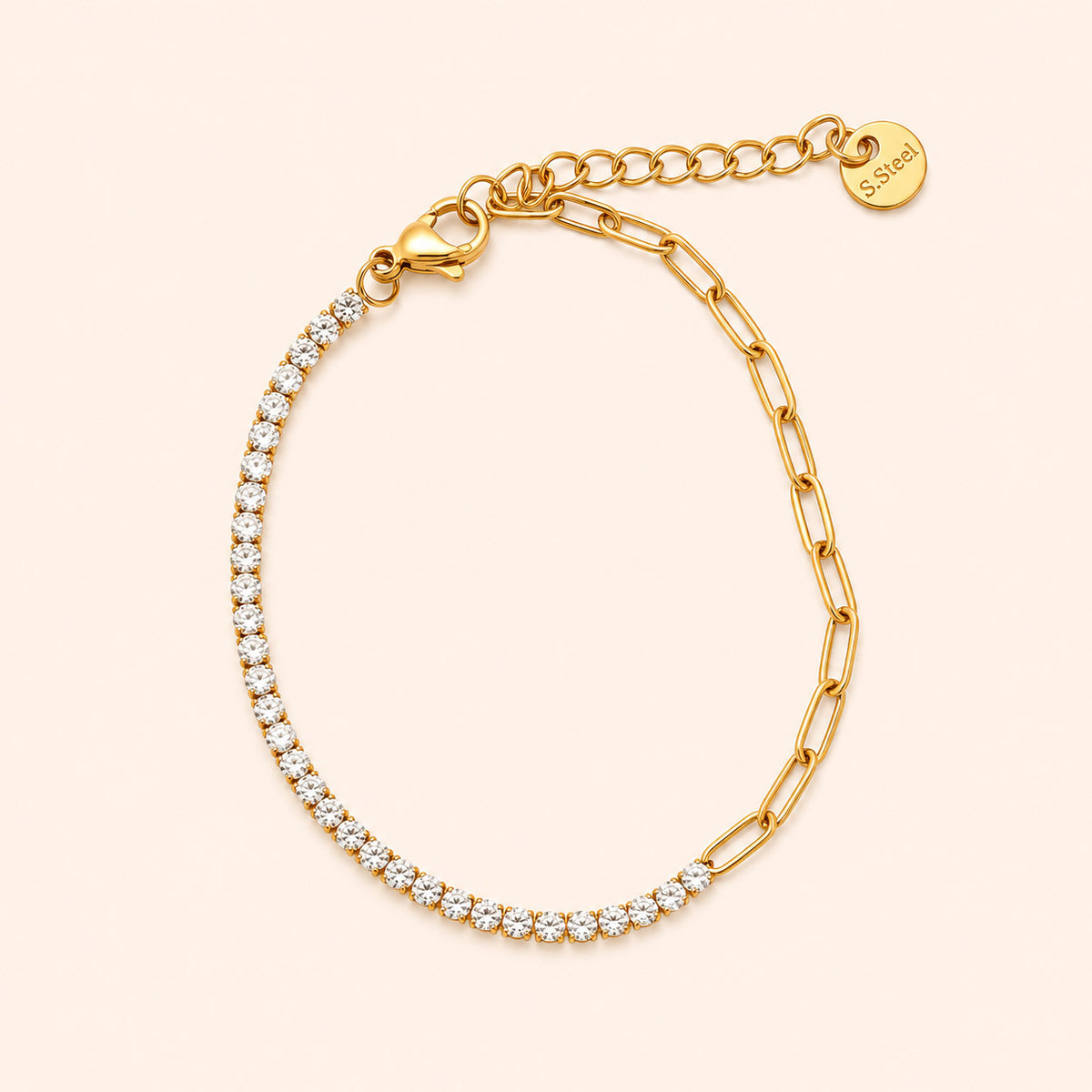 Gold bracelet with CZ stones on a beige background
