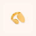A minimalist 18K gold-toned open ring band with a smooth, polished finish, displayed on a clean, solid off-white background.